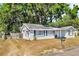 A cozy single-Gathering home featuring a well-kept yard and classic suburban charm, showcasing a relaxed living environment at 1480 E Davidson St, Bartow, FL 33830