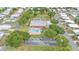Community amenity view showcasing a pool, recreation center, parking, and lush landscaping at 1610 Reynolds Rd # 353, Lakeland, FL 33801
