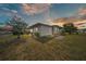 Exterior showcasing a backyard with minimal landscaping and a patio area at 1610 Reynolds Rd # 353, Lakeland, FL 33801
