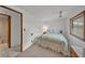 Comfortable bedroom features a ceiling fan, neutral carpet, and a window for natural light at 1610 Reynolds Rd # 353, Lakeland, FL 33801