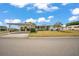 Charming single-story home featuring a carport and a cozy front porch with manicured landscaping and bright white paint at 1610 Reynolds Rd # 353, Lakeland, FL 33801