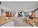 Open-concept living area with multiple seating options and an inviting atmosphere for gatherings at 1610 Reynolds Rd # 353, Lakeland, FL 33801