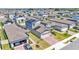 Aerial view of a neighborhood featuring multiple two-story homes with solar panels at 1859 Carnostie Rd, Winter Haven, FL 33884