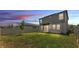 Large backyard with a green lawn and a white fence, perfect for outdoor activities at 1859 Carnostie Rd, Winter Haven, FL 33884