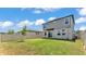 A well-maintained lawn featuring a large backyard and fence at 1859 Carnostie Rd, Winter Haven, FL 33884