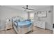Bedroom with furniture, ceiling fan, closet, and good natural light from the window at 1859 Carnostie Rd, Winter Haven, FL 33884