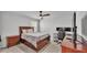 Bedroom with ceiling fan, closet, gaming setup, furniture, and good natural light from the window at 1859 Carnostie Rd, Winter Haven, FL 33884