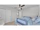 Cozy bedroom with ceiling fan, closet, and good natural light from the window at 1859 Carnostie Rd, Winter Haven, FL 33884