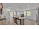 Modern kitchen featuring granite countertops, stainless steel appliances, and an open floor plan at 1859 Carnostie Rd, Winter Haven, FL 33884
