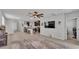 A open concept floor plan with a living room, kitchen and eating area with tile floors and neutral walls at 1859 Carnostie Rd, Winter Haven, FL 33884