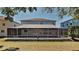 Expansive backyard featuring a large screened in patio, perfect for outdoor living at 6918 Lake Eaglebrooke Dr, Lakeland, FL 33813
