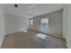Bright bedroom featuring neutral carpeting, plenty of natural light and closet at 6918 Lake Eaglebrooke Dr, Lakeland, FL 33813