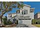Charming two-story home boasts a well-manicured lawn and a welcoming two-car garage at 6918 Lake Eaglebrooke Dr, Lakeland, FL 33813