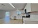 The sleek kitchen offers stainless appliances, and a view to the backyard and patio at 6918 Lake Eaglebrooke Dr, Lakeland, FL 33813
