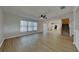 Bright living room with ceiling fan flows seamlessly into the adjacent kitchen area at 6918 Lake Eaglebrooke Dr, Lakeland, FL 33813