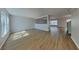 Spacious living room features lots of natural light and wood-look flooring throughout at 6918 Lake Eaglebrooke Dr, Lakeland, FL 33813
