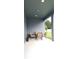 Covered back patio showcasing recessed lighting, a dining table, and an outdoor seating area at 753 Grand Hilltop Dr, Apopka, FL 32703