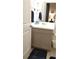 Modern bathroom with a neutral color vanity and blue accents at 753 Grand Hilltop Dr, Apopka, FL 32703