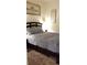 Cozy bedroom with dark wood furniture and patterned bedding at 753 Grand Hilltop Dr, Apopka, FL 32703