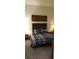 Comfortable bedroom with modern decor and a skyline painting at 753 Grand Hilltop Dr, Apopka, FL 32703