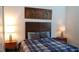 Comfortable bedroom with modern decor and a skyline painting at 753 Grand Hilltop Dr, Apopka, FL 32703