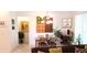 Inviting dining area with natural light, modern art, comfortable seating, with living space at 753 Grand Hilltop Dr, Apopka, FL 32703