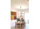 Bright dining room with table and chairs, stylish lighting, and decor elements at 753 Grand Hilltop Dr, Apopka, FL 32703