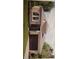 Exterior elevation featuring a two-car garage, neutral paint, and a well-manicured lawn at 753 Grand Hilltop Dr, Apopka, FL 32703