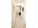 Bright hallway featuring neutral tile flooring and decorative art at 753 Grand Hilltop Dr, Apopka, FL 32703