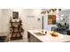 Modern kitchen with island, sink, stainless appliances, and bright light fixtures at 753 Grand Hilltop Dr, Apopka, FL 32703