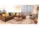 Inviting living room with a comfortable sectional sofa, round coffee table, and stylish decor at 753 Grand Hilltop Dr, Apopka, FL 32703