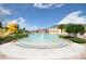 Splash pool featuring water features, a slide, and lounge chairs for relaxation in a Gathering-friendly area at 4767 Waltham Forest Dr, Davenport, FL 33837