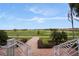 Overlook the golf course from the building's steps, mature manicured landscaping in view at 4804 Waltham Forest Dr, Davenport, FL 33837
