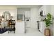 Modern kitchen with stainless steel appliances, white cabinets, and adjacent dining area at 959 Hour Glass Rd, Lakeland, FL 33801
