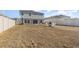 Backyard featuring a cozy fire pit area surrounded by chairs and privacy fencing at 1646 Seth Dr, Winter Haven, FL 33880