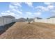 Expansive backyard featuring a cozy fire pit area surrounded by chairs and privacy fencing at 1646 Seth Dr, Winter Haven, FL 33880