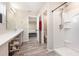Bright bathroom featuring a modern vanity, updated fixtures, and a walk-in shower at 1646 Seth Dr, Winter Haven, FL 33880