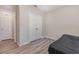 Bedroom featuring stylish wood-look floors, a double door closet, and a neutral color palette at 1646 Seth Dr, Winter Haven, FL 33880