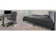 Inviting bedroom featuring carpet, a modern desk, and a comfortable sleeping area at 1646 Seth Dr, Winter Haven, FL 33880
