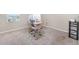 Bedroom area featuring plush carpeting and a desk with dual monitors, creating a functional workspace at 1646 Seth Dr, Winter Haven, FL 33880