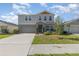 Charming two-story home with a well-manicured lawn and attached two-car garage at 1646 Seth Dr, Winter Haven, FL 33880