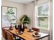 Well-lit dining room with a wooden table and large window providing natural light at 1880 Bright Sky Dr, Kissimmee, FL 34744