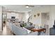 Open living room connecting seamlessly to the kitchen, with stylish decor and natural light at 1880 Bright Sky Dr, Kissimmee, FL 34744
