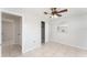Bedroom with a ceiling fan, closet, tiled floor, and natural light at 222 Aldo Dr, Babson Park, FL 33827