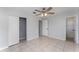 Bedroom with a ceiling fan, closet, tiled floor, and ensuite bath at 222 Aldo Dr, Babson Park, FL 33827