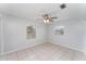 Bedroom with a ceiling fan, tiled floor, and natural light at 222 Aldo Dr, Babson Park, FL 33827