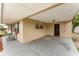 Covered carport with neutral tone brick walls and concrete slab floor at 222 Aldo Dr, Babson Park, FL 33827
