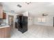 A modern kitchen offers an open concept with granite countertops and stainless steel appliances at 222 Aldo Dr, Babson Park, FL 33827