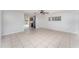 An open concept floor plan features tiled flooring and neutral walls with backyard access at 222 Aldo Dr, Babson Park, FL 33827