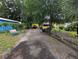 Backyard of home featuring chairs and a yellow garage at 730 Citrus St, Orlando, FL 32805